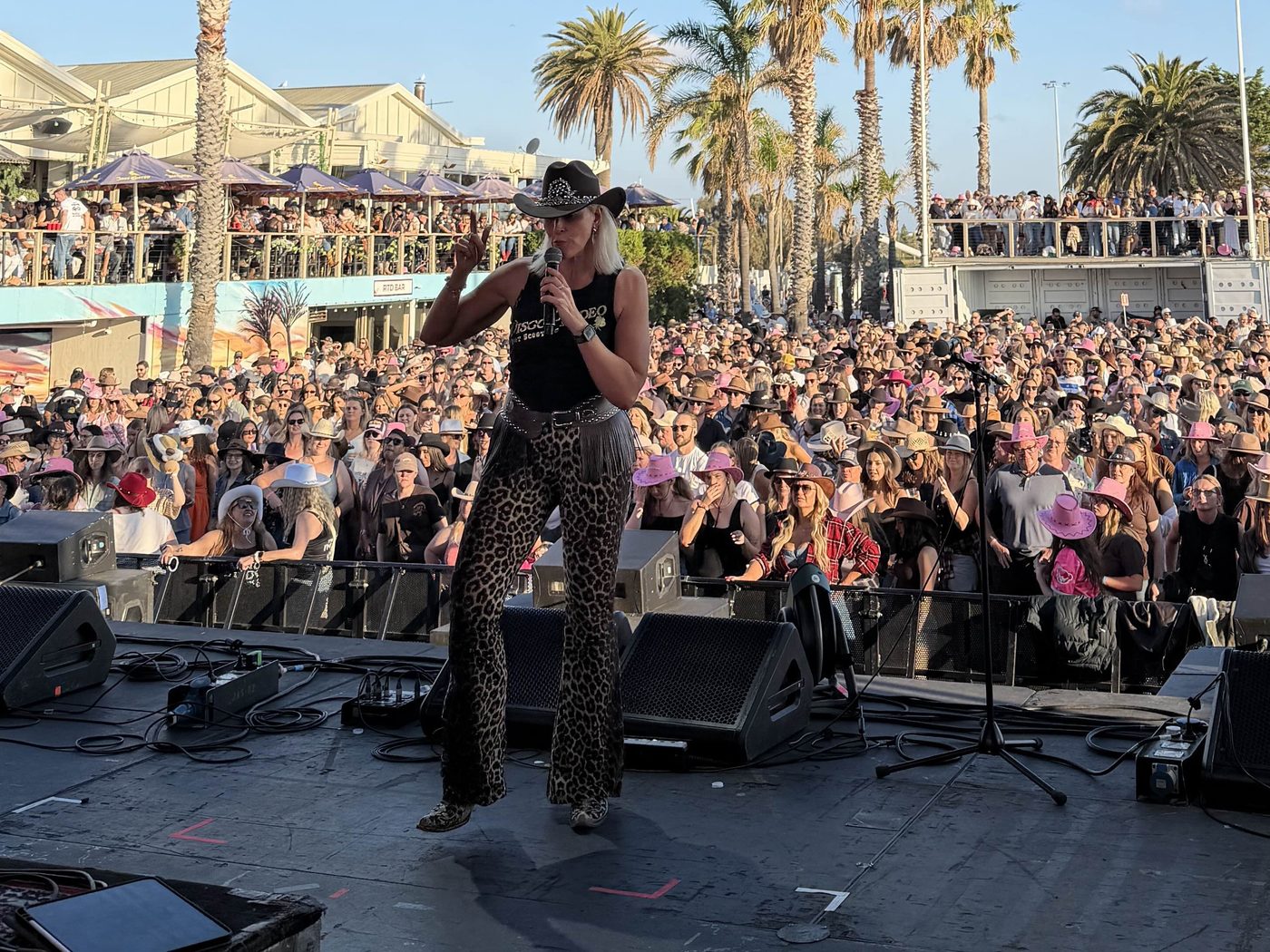 Kirsten Mann on the mic leading a huge festival crowd