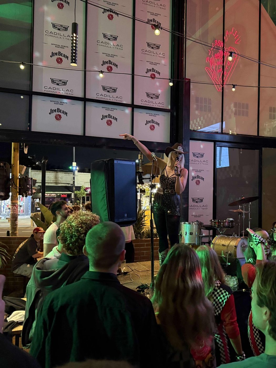 Kirsten Mann performing on the Cadillac and Jim Beam branded stage at a corporate event