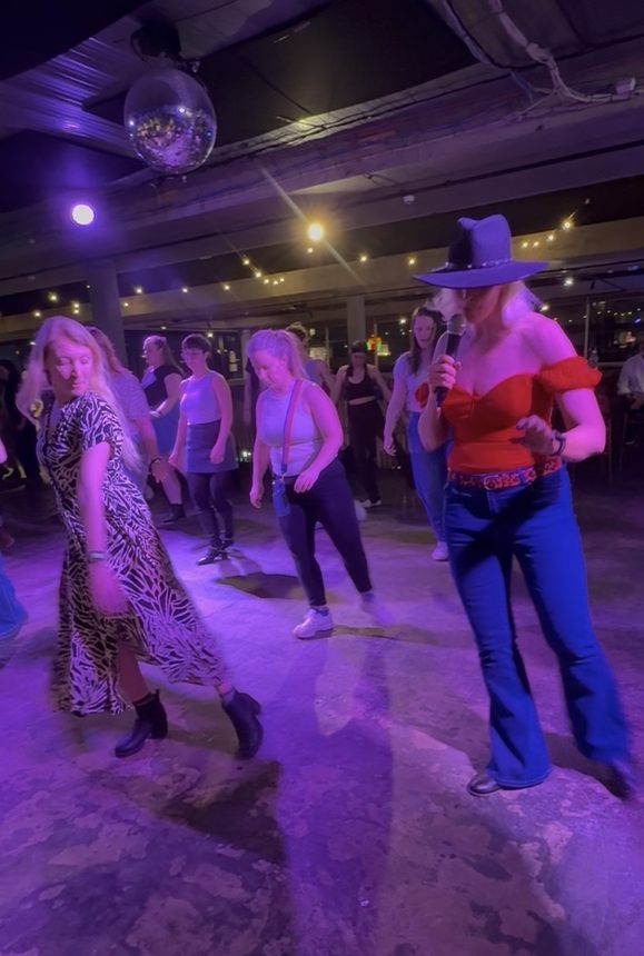 Boot Scooting Society guests dancing together at a private event in Melbourne