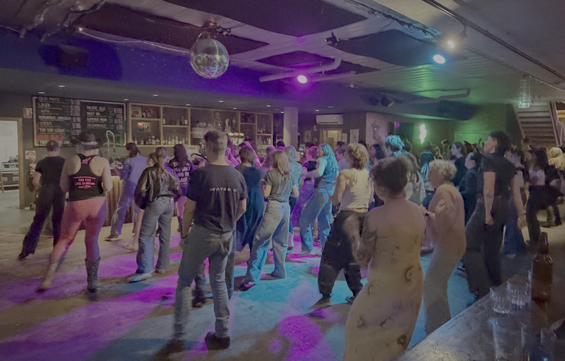A packed Boot Scooting Society line dancing floor