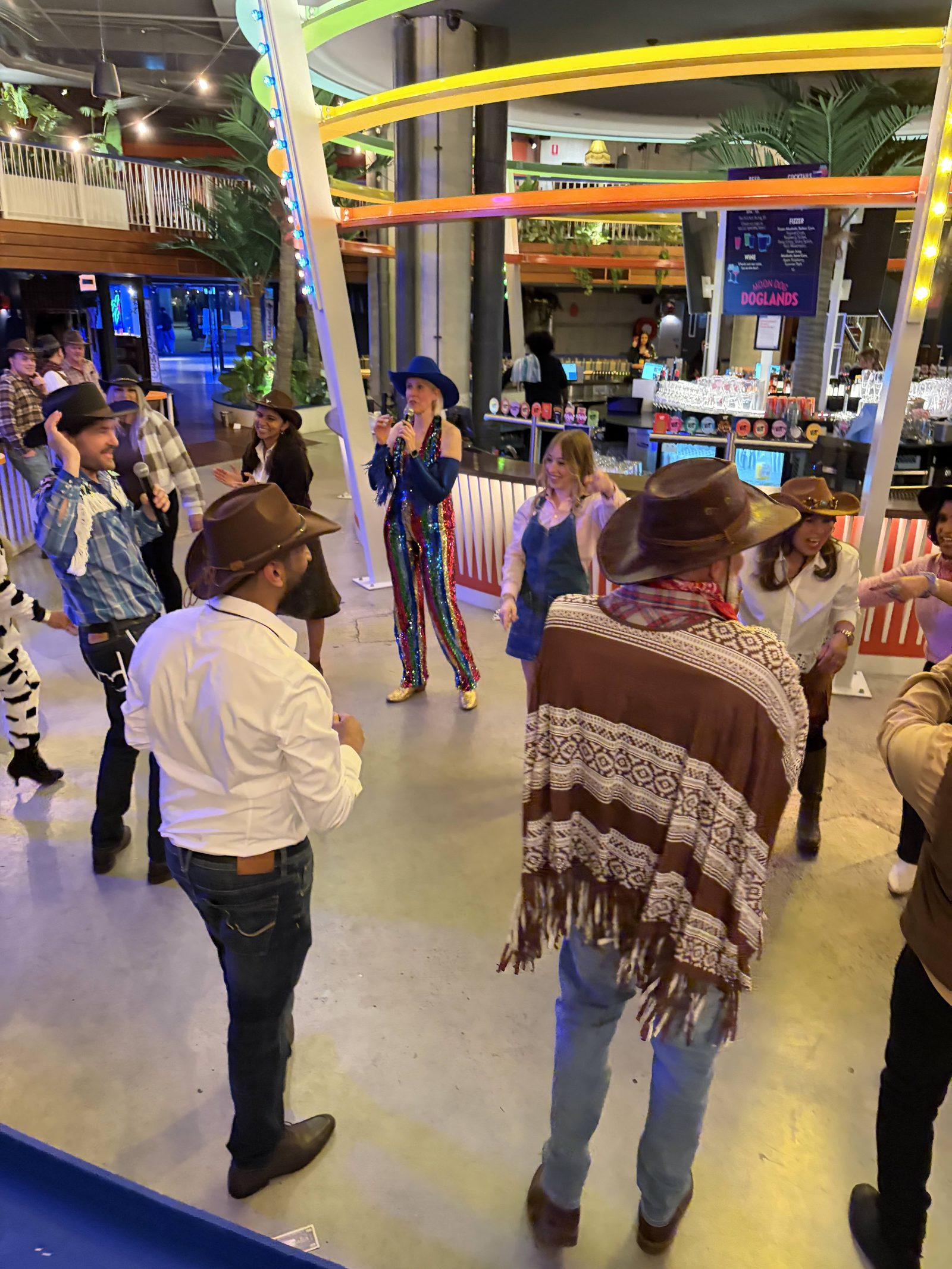 A corporate Christmas party in Melbourne with the whole team boot scootin' together